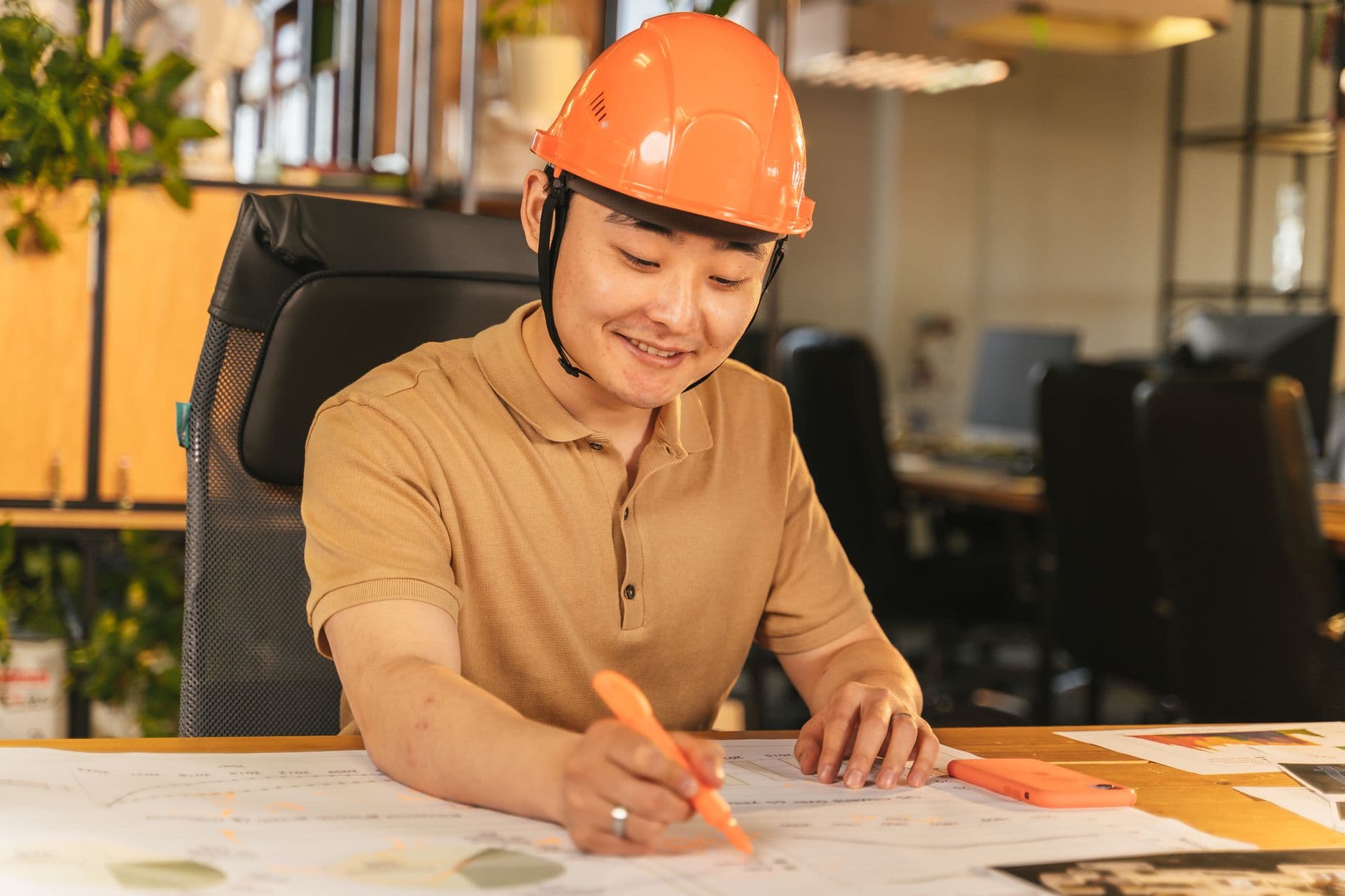 Construction supervisor reviewing certified payroll paperwork on a job site