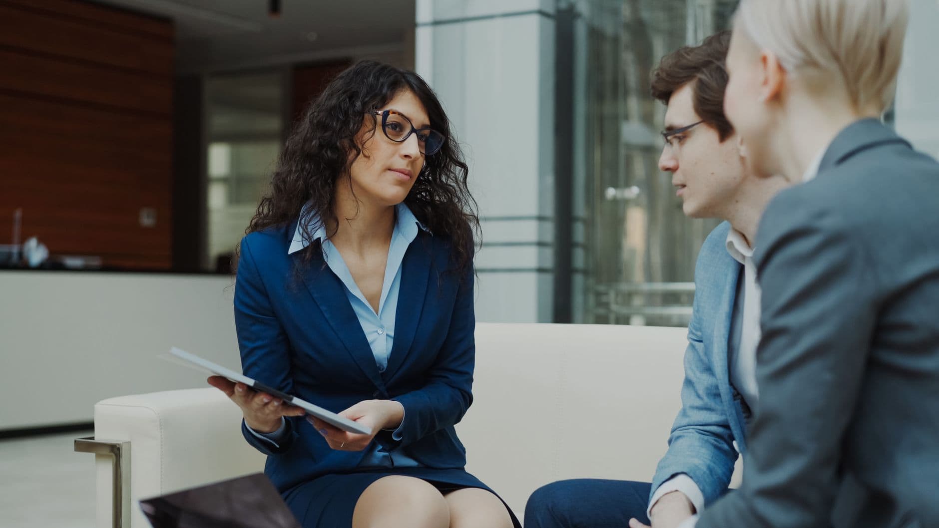 Business owner and advisor discussing cash flow forecast documents