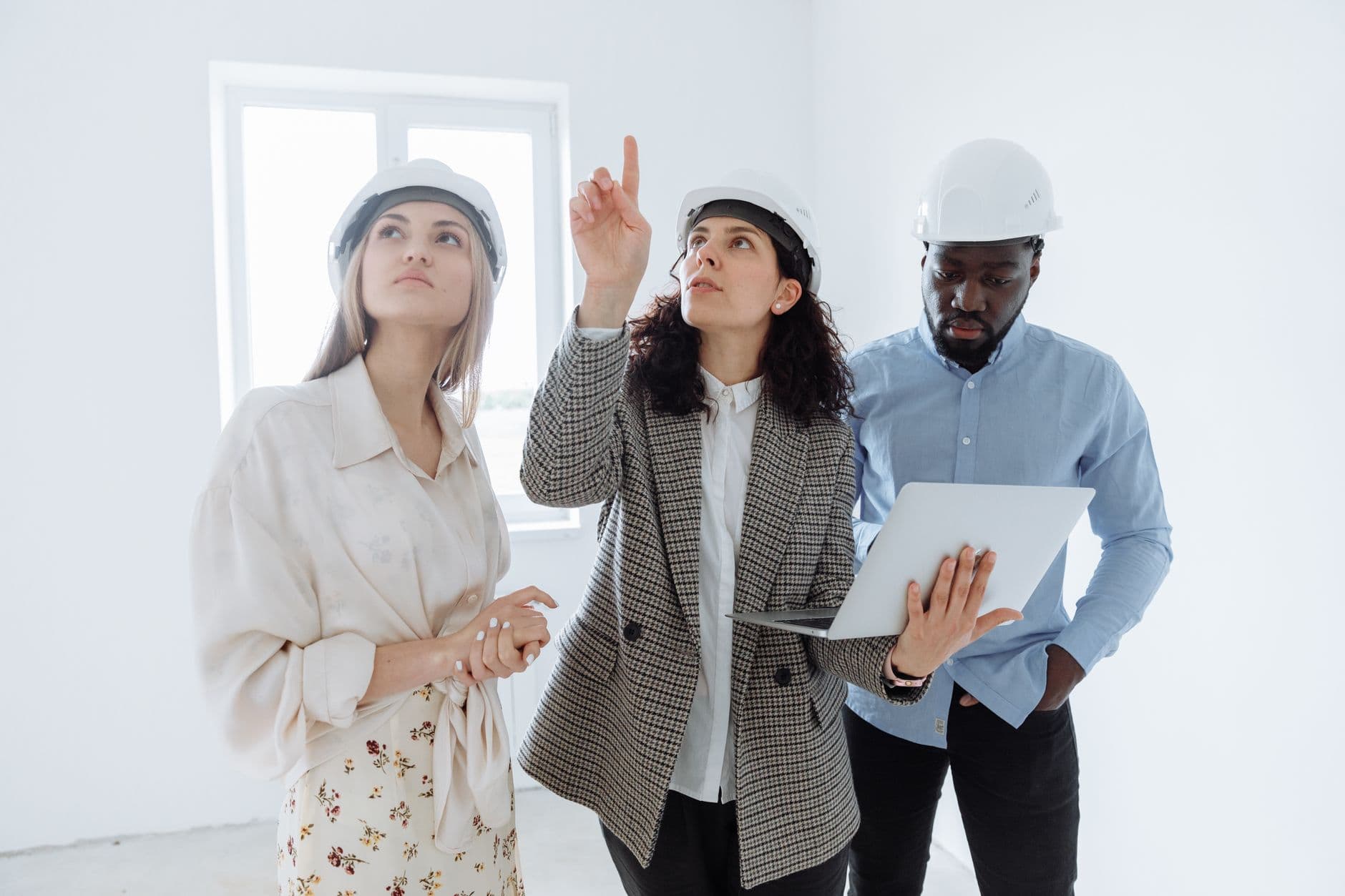 Contractor reviewing financial reports on a laptop at a job site