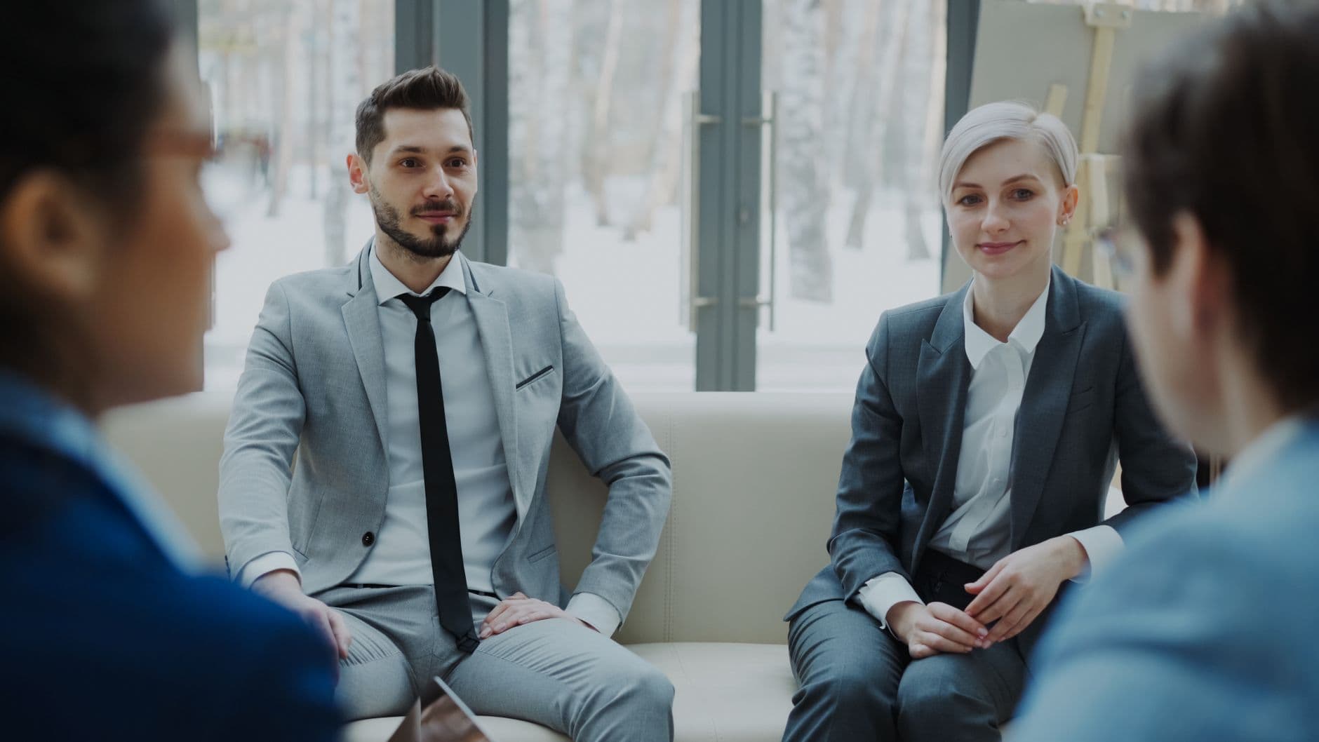 Engineering firm partners discussing financial strategy in a meeting room