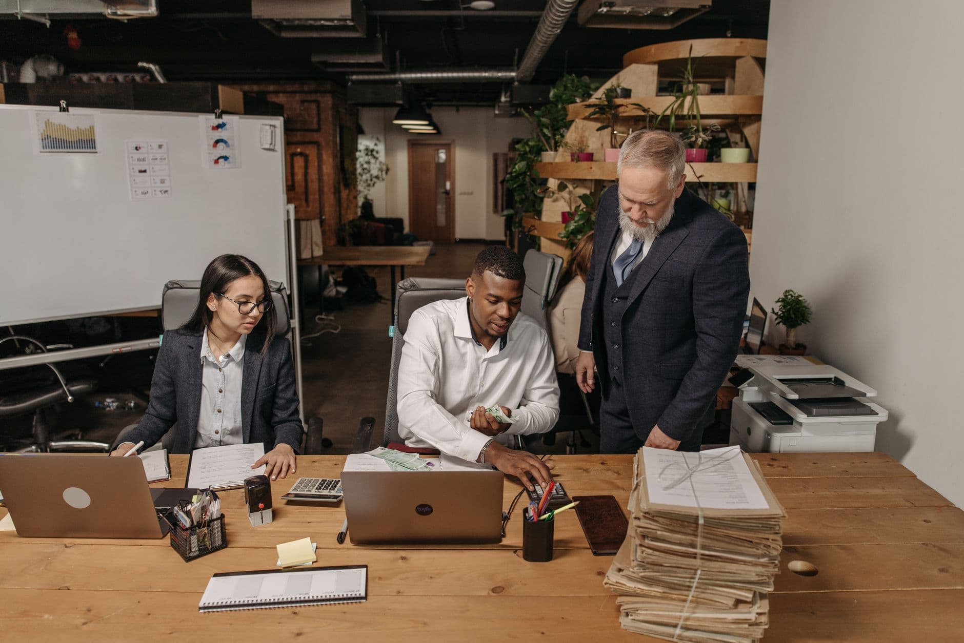 Accountant reviewing personal tax documents with a household client