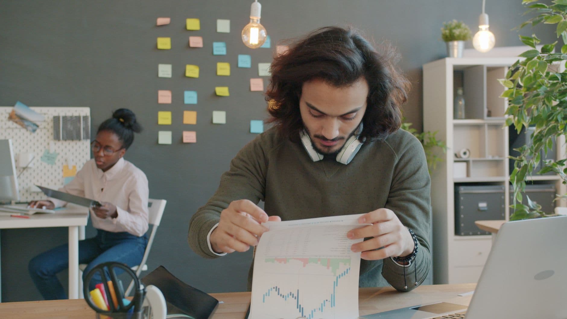 Business owner reviewing a monthly accounting invoice with an advisor
