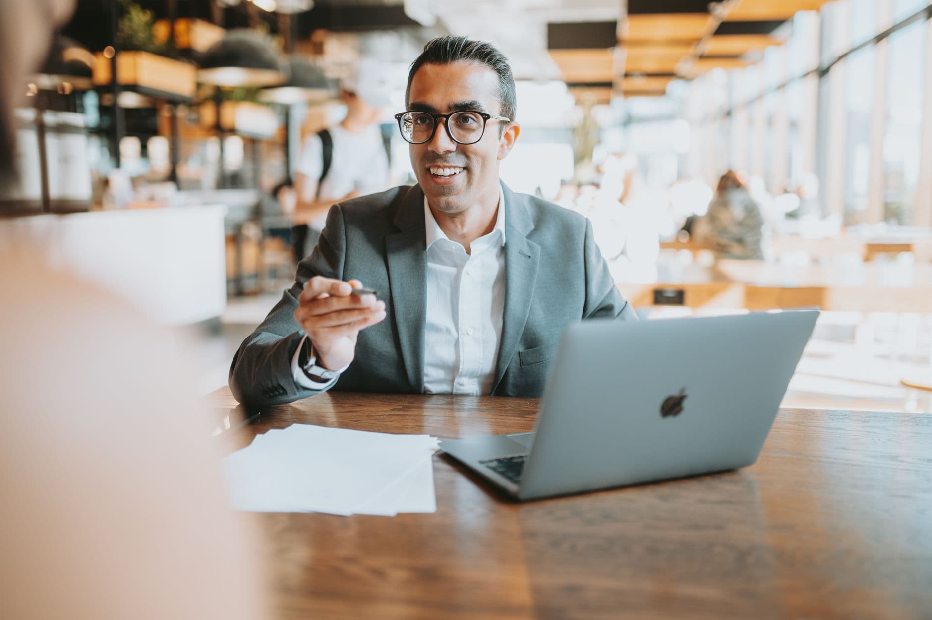 CPA team member reviewing accounting reports on a laptop with a business client