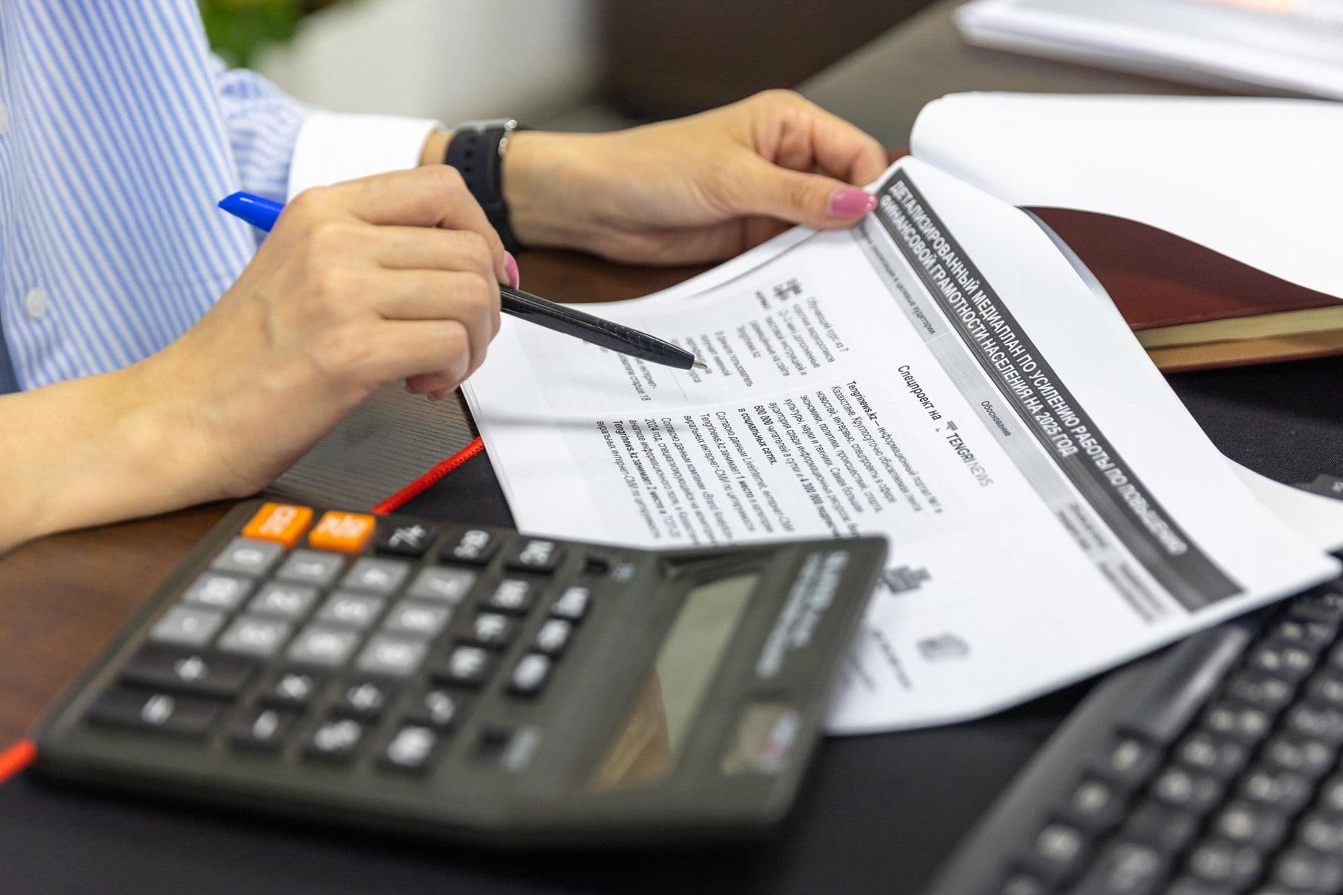 CPA reviewing law firm bookkeeping records on a laptop