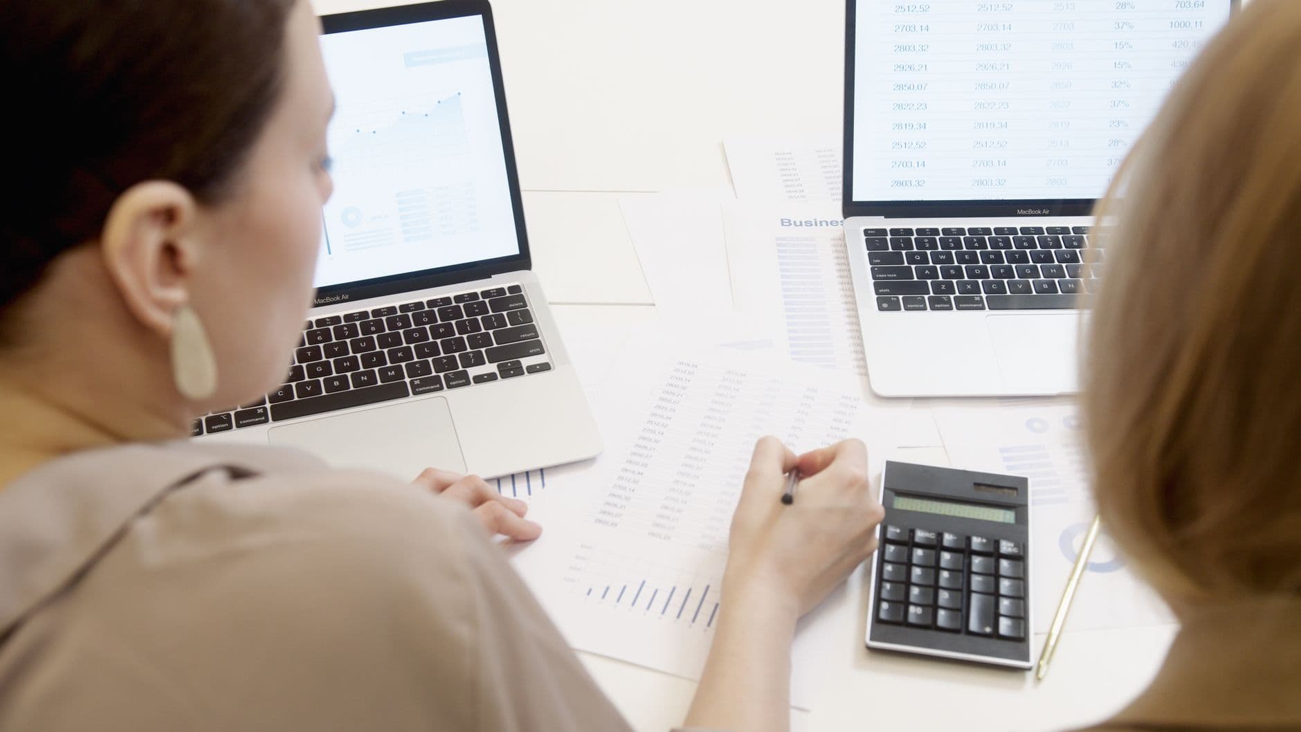 Business owner reviewing financial dashboard on a laptop screen