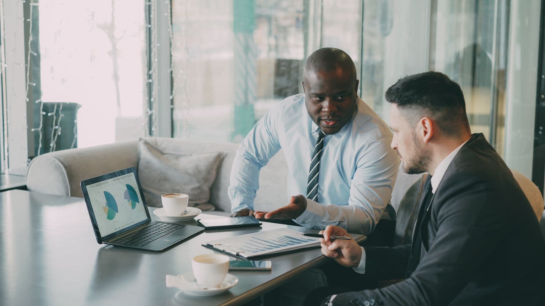 Business owner reviewing real-time financial dashboard on a laptop