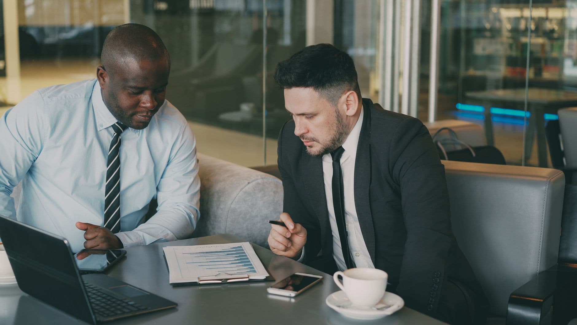Business owner viewing real-time financial dashboard on a laptop