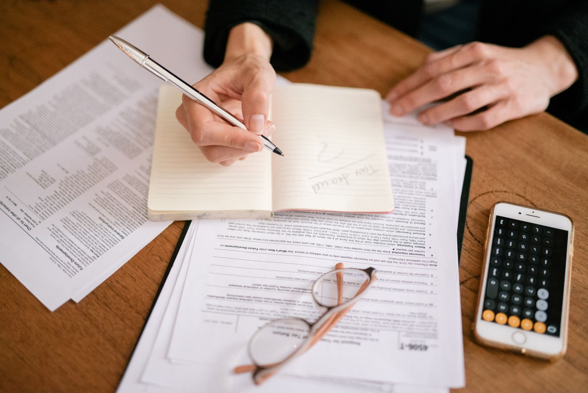 Tax documents and calculator on desk for legal practice tax planning
